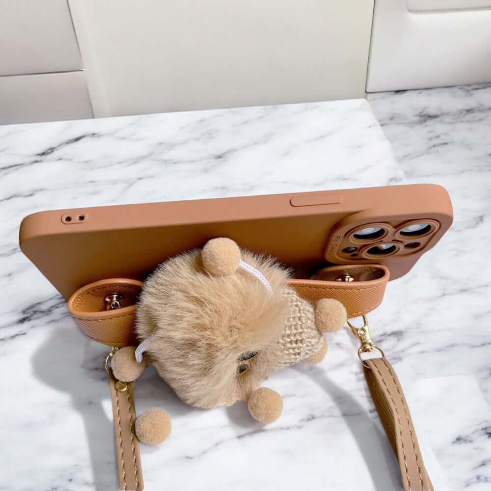 a stuffed animal is in a purse on a table