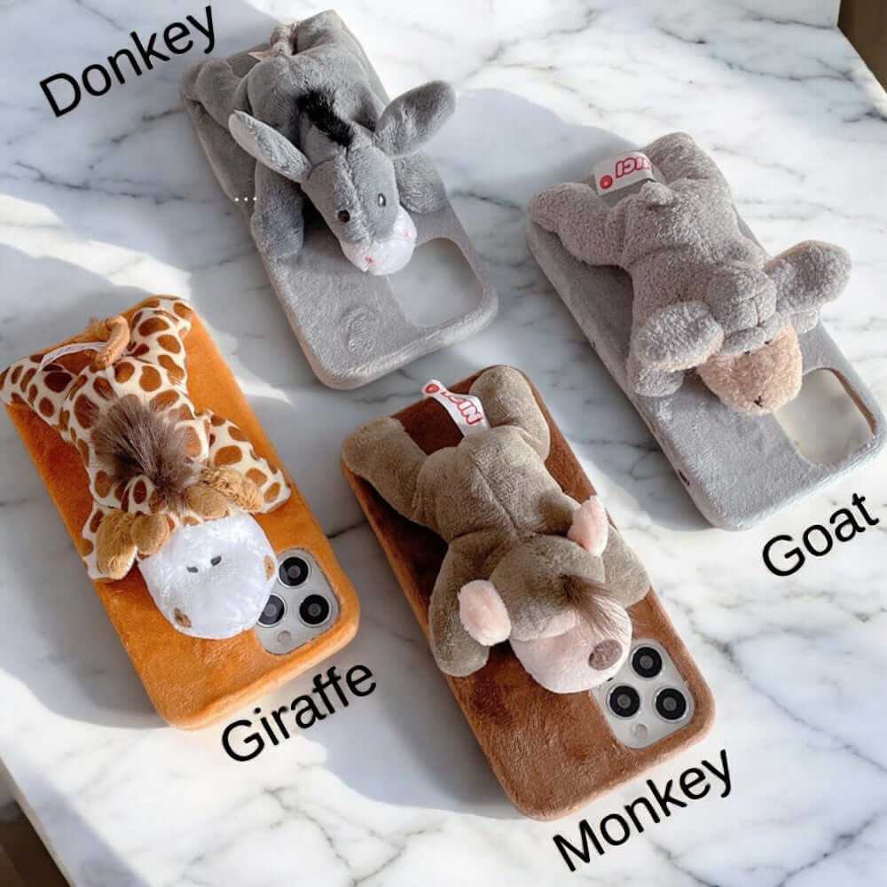 a group of stuffed animals sitting on top of a counter