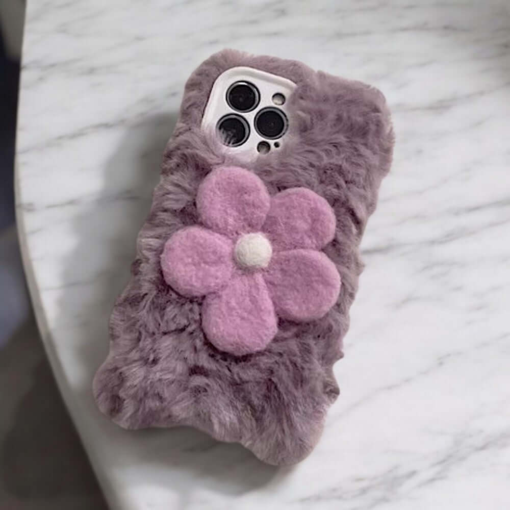 a cell phone case with a flower on it