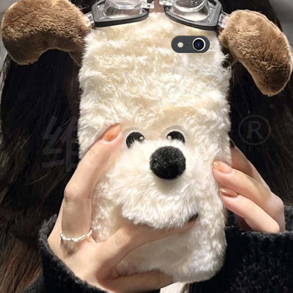 a woman holding a stuffed dog wearing glasses