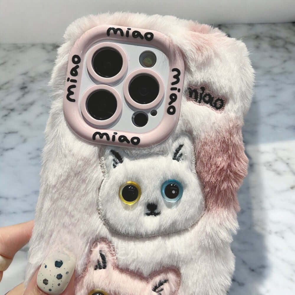 a person holding a phone case with a cat on it