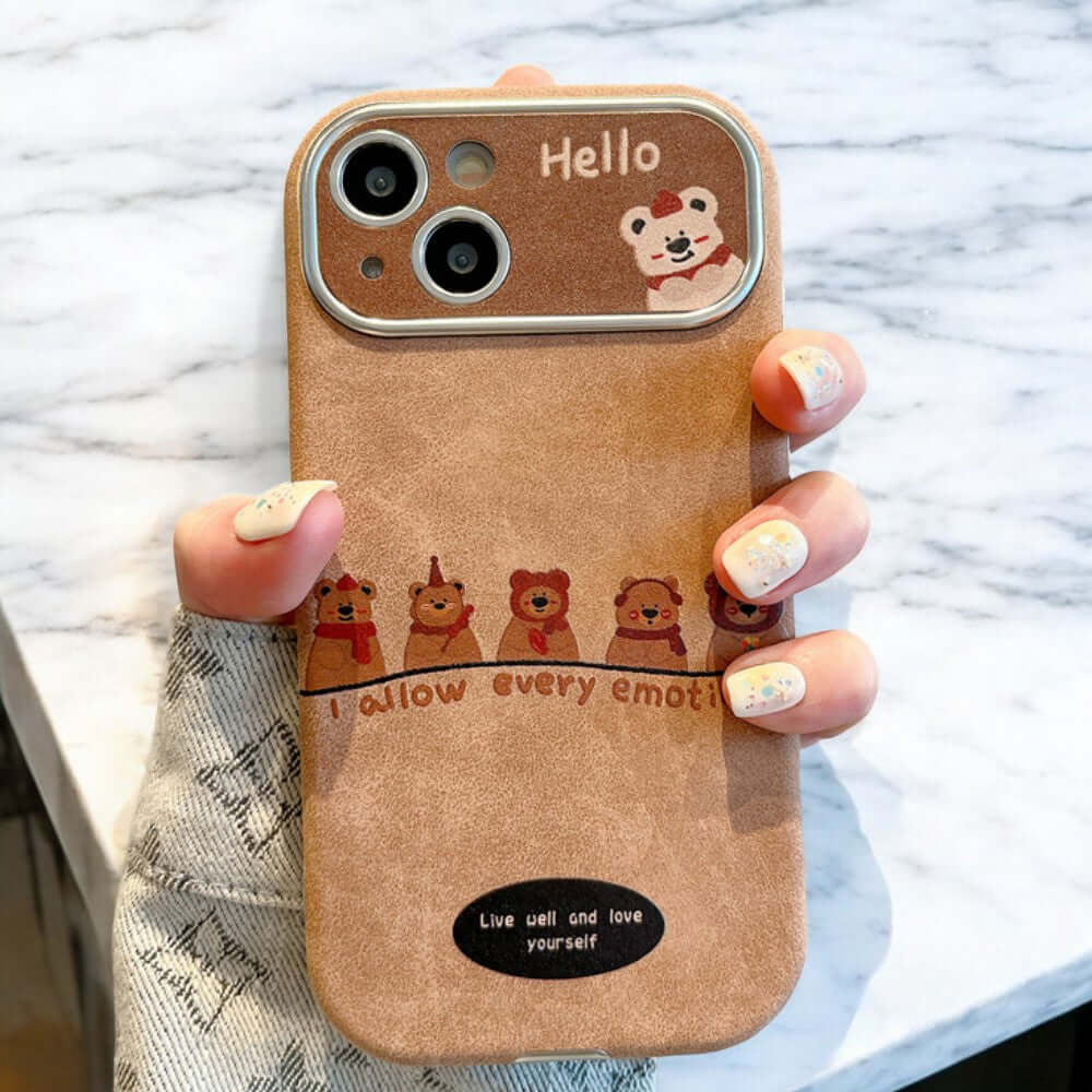 a person holding up a phone case with a picture of bears on it