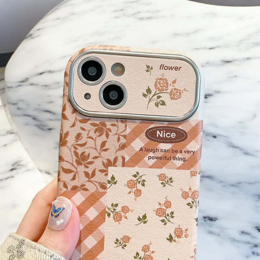 a person holding a cell phone case with flowers on it