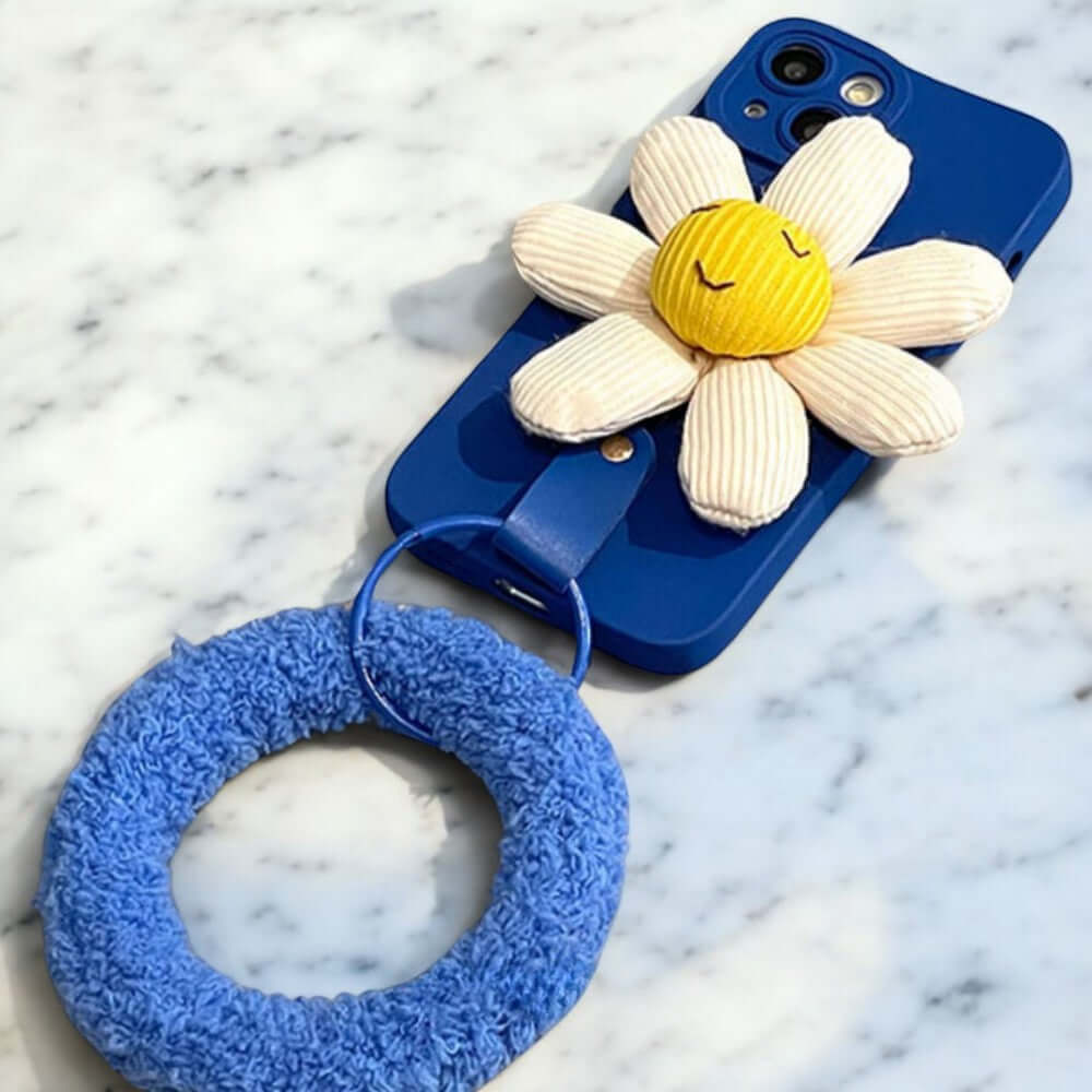 a blue phone case with a flower on it