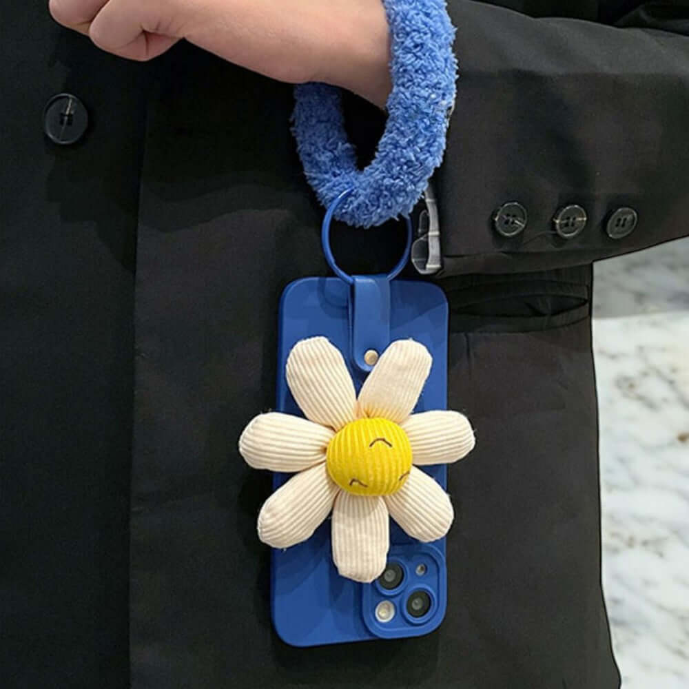 a person wearing a blue jacket with a flower on it