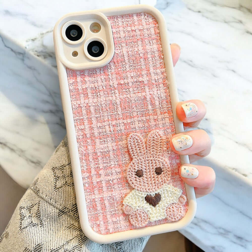 a person holding a phone case with a bunny on it