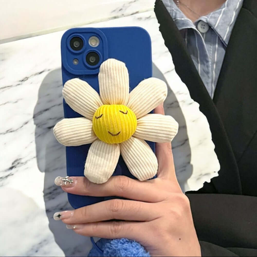 a woman holding a cell phone with a flower on it