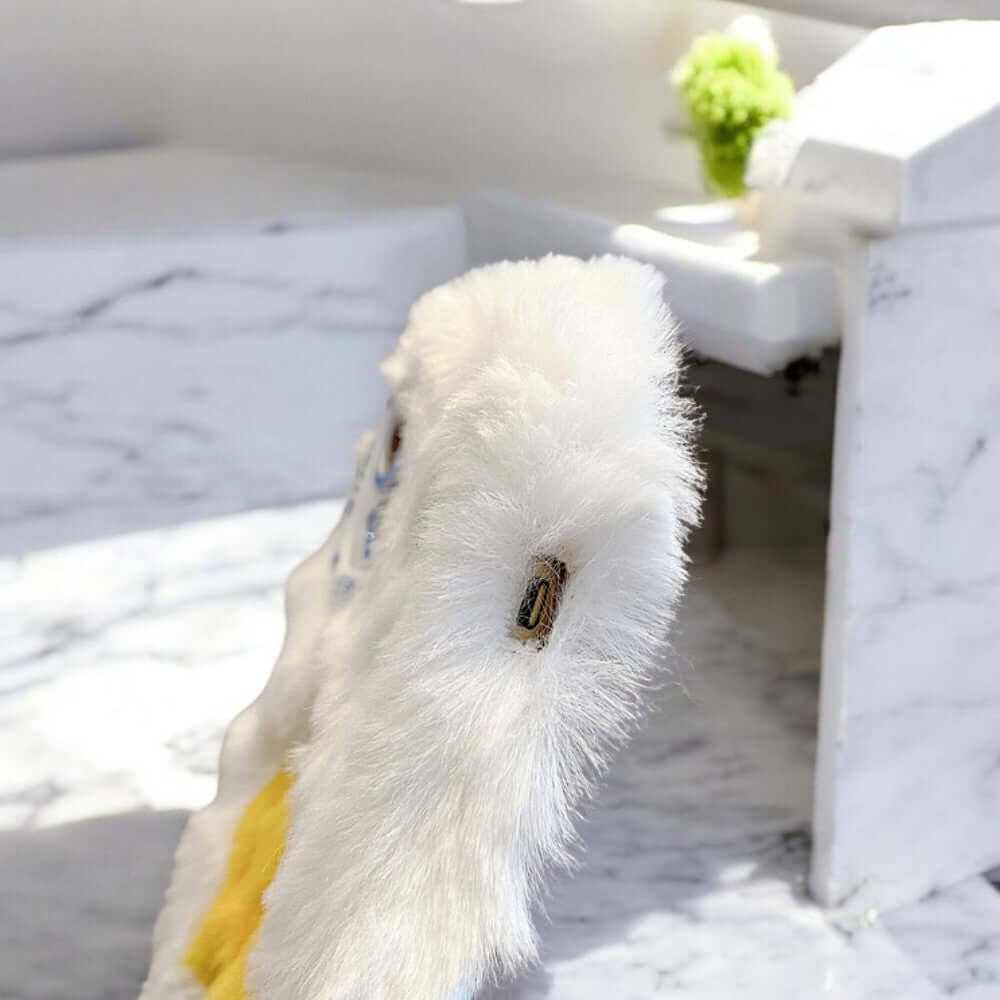 a stuffed animal is sitting on a table