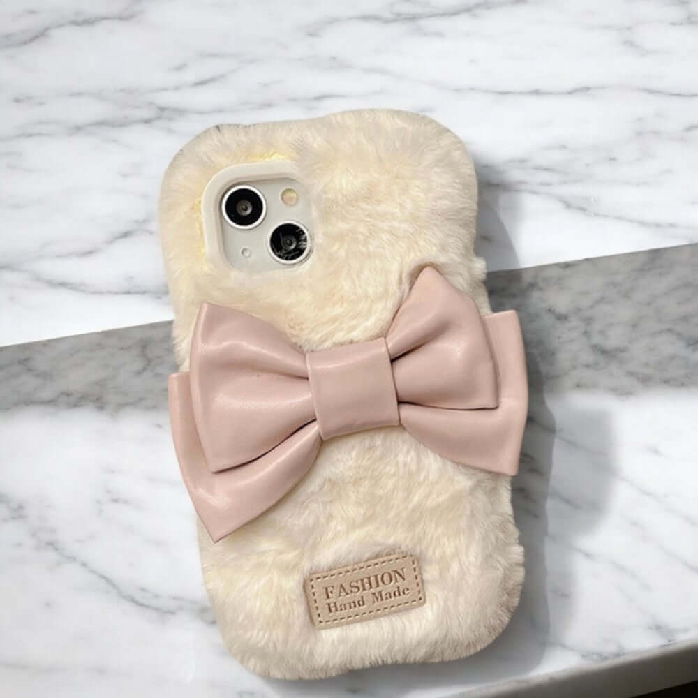 a phone case with a bow on it