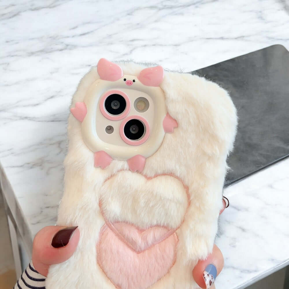 a person holding a phone case with a heart on it