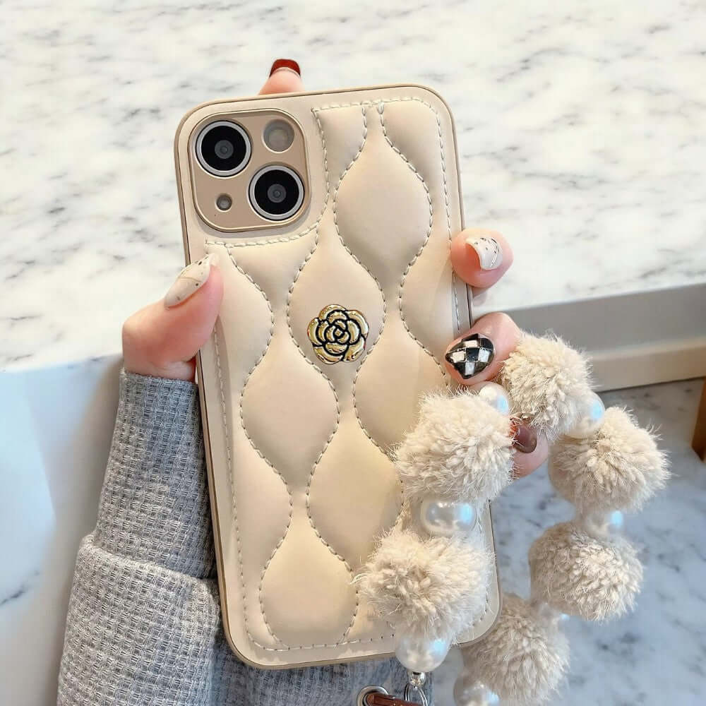 a person holding a phone case with a poodle on it